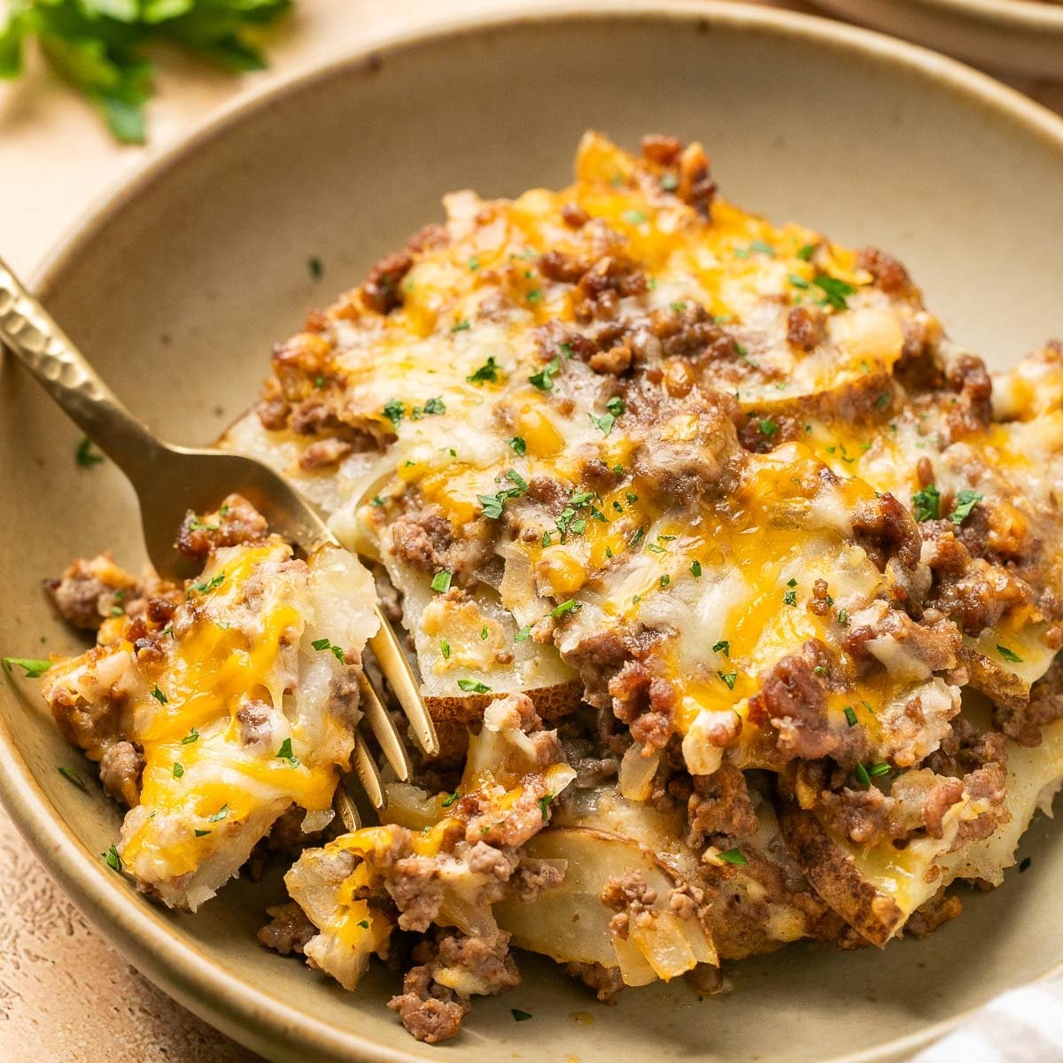 ground beef and potatoes casserole golden brown bubbling cheese