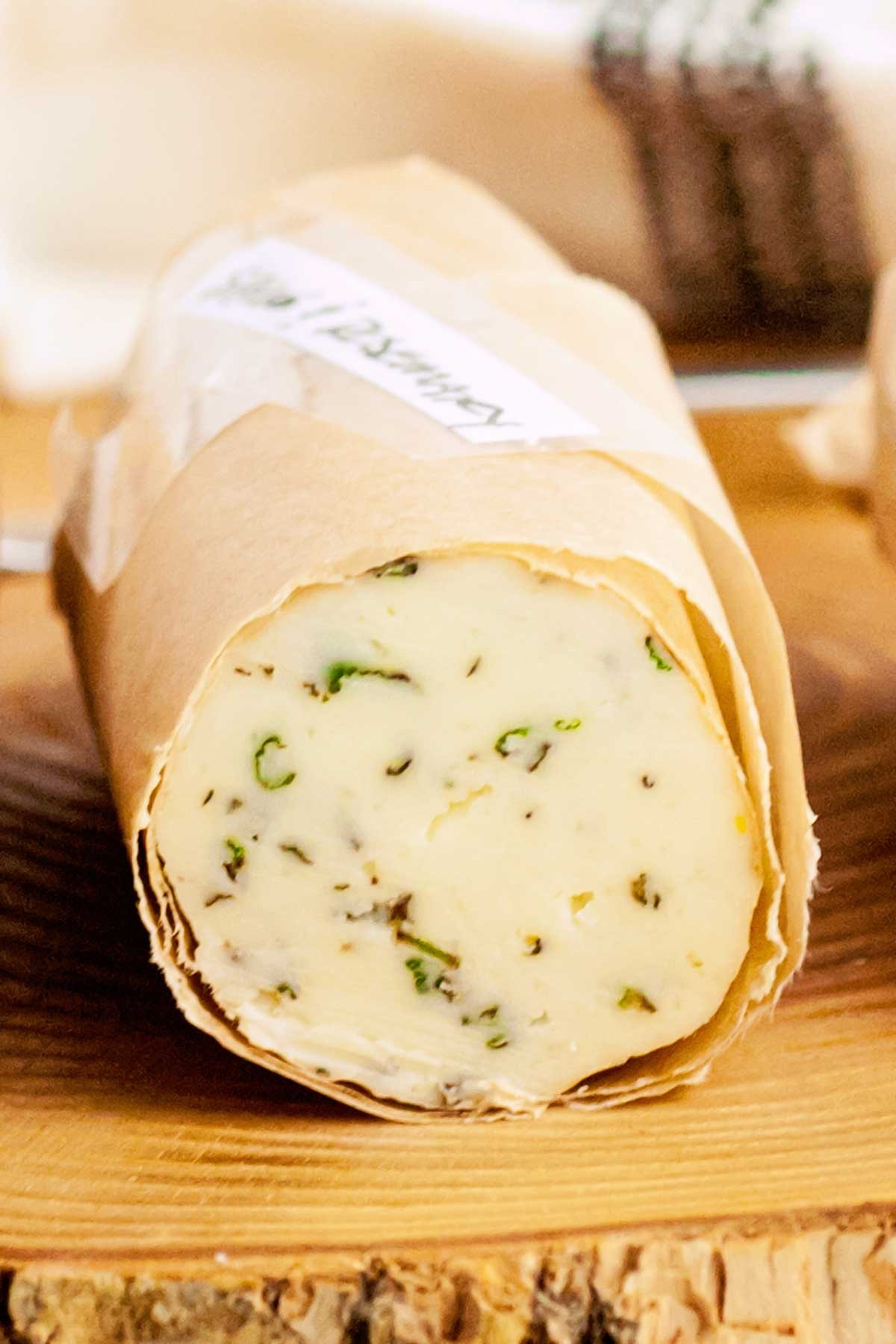Close-up shot of a pat of rosemary and sage butter on a baking sheet