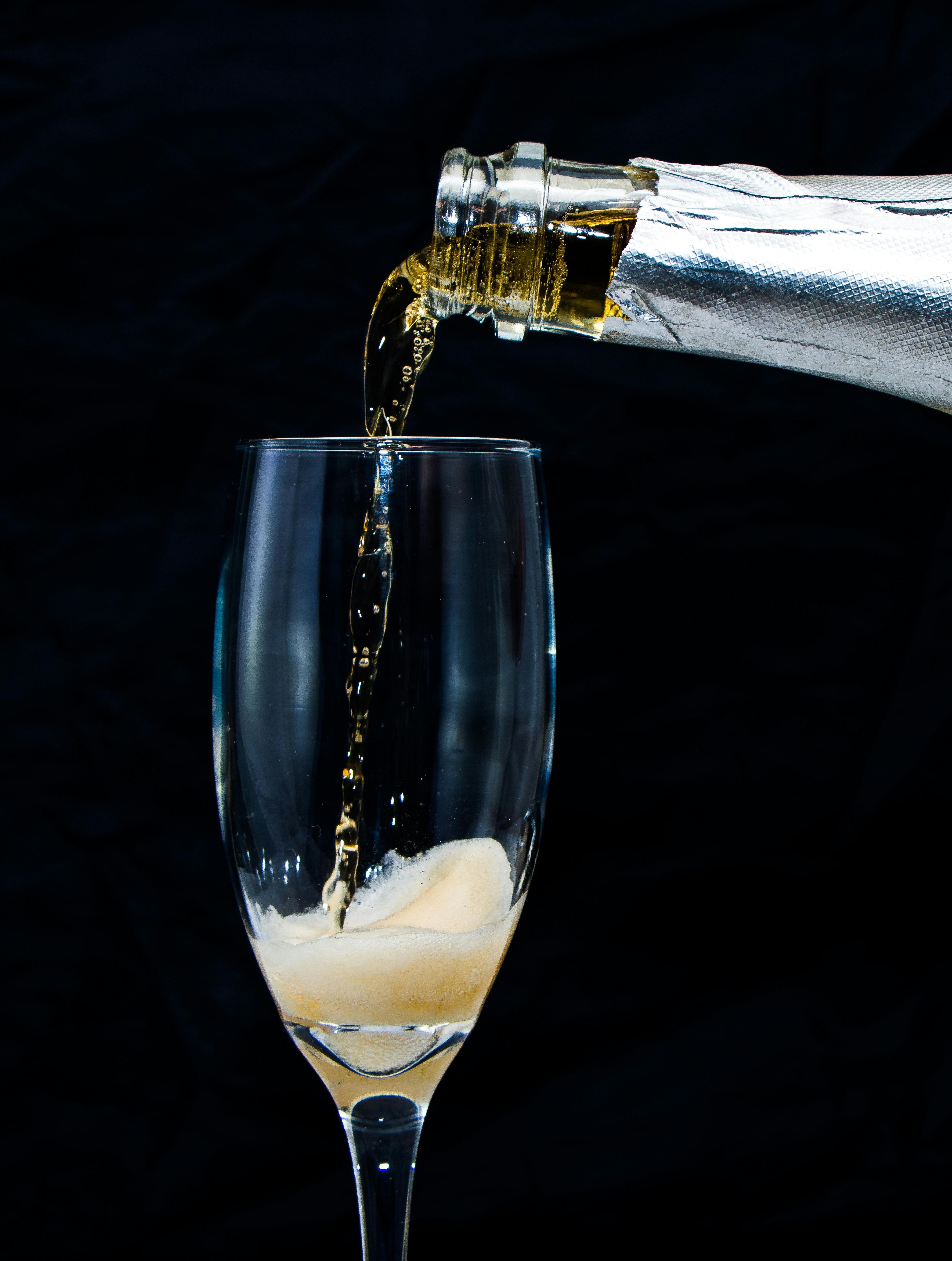Close-up shot of a champagne-infused coffee in a glass, with condensation