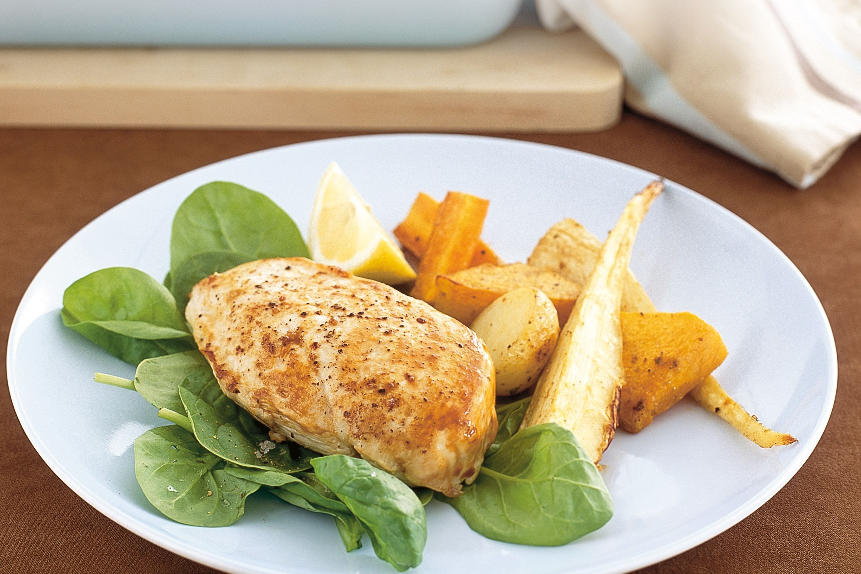 closeup of cumin roasted chicken with charred vegetables