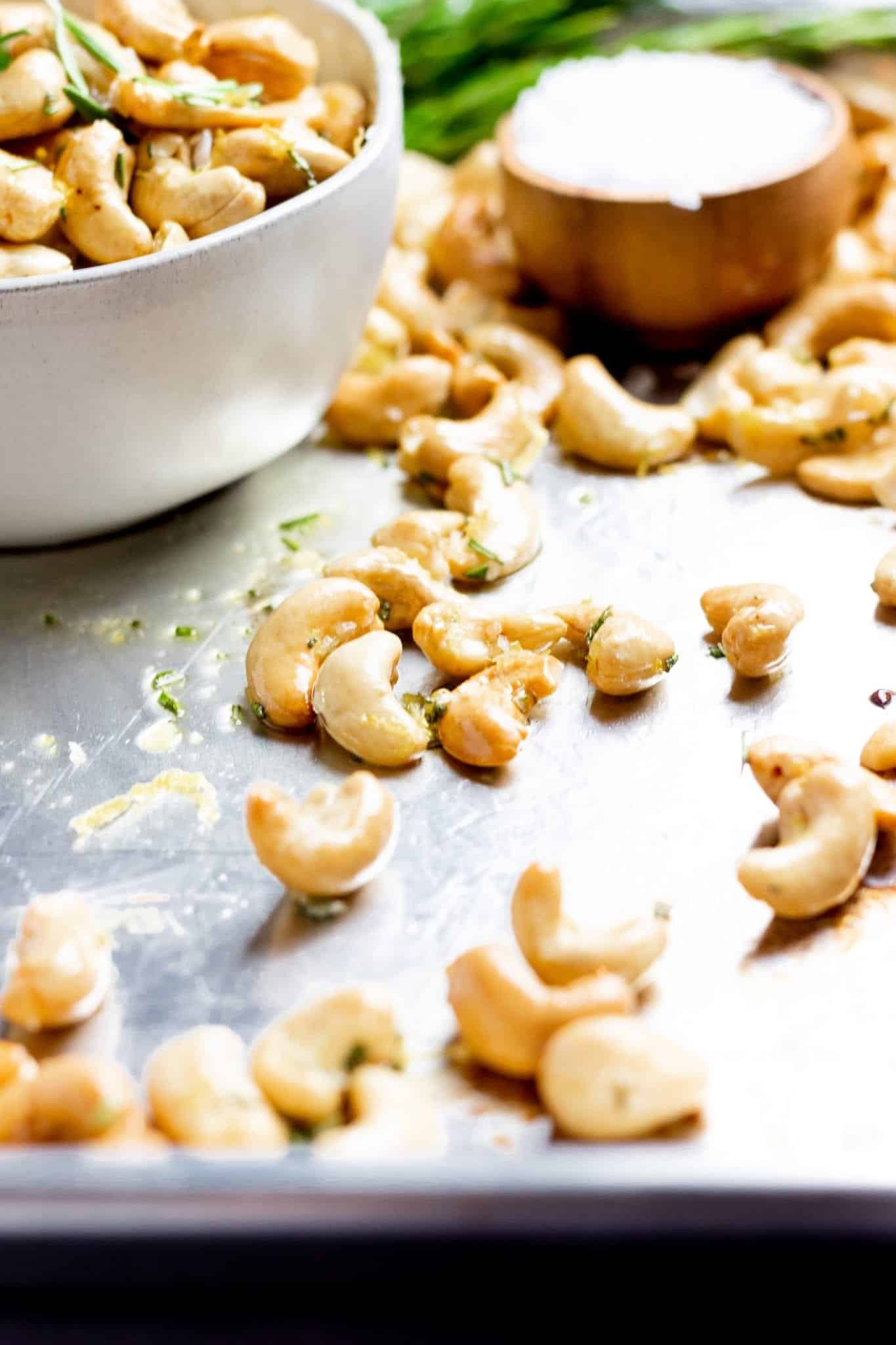 lemon garlic roasted cashews on a wooden board