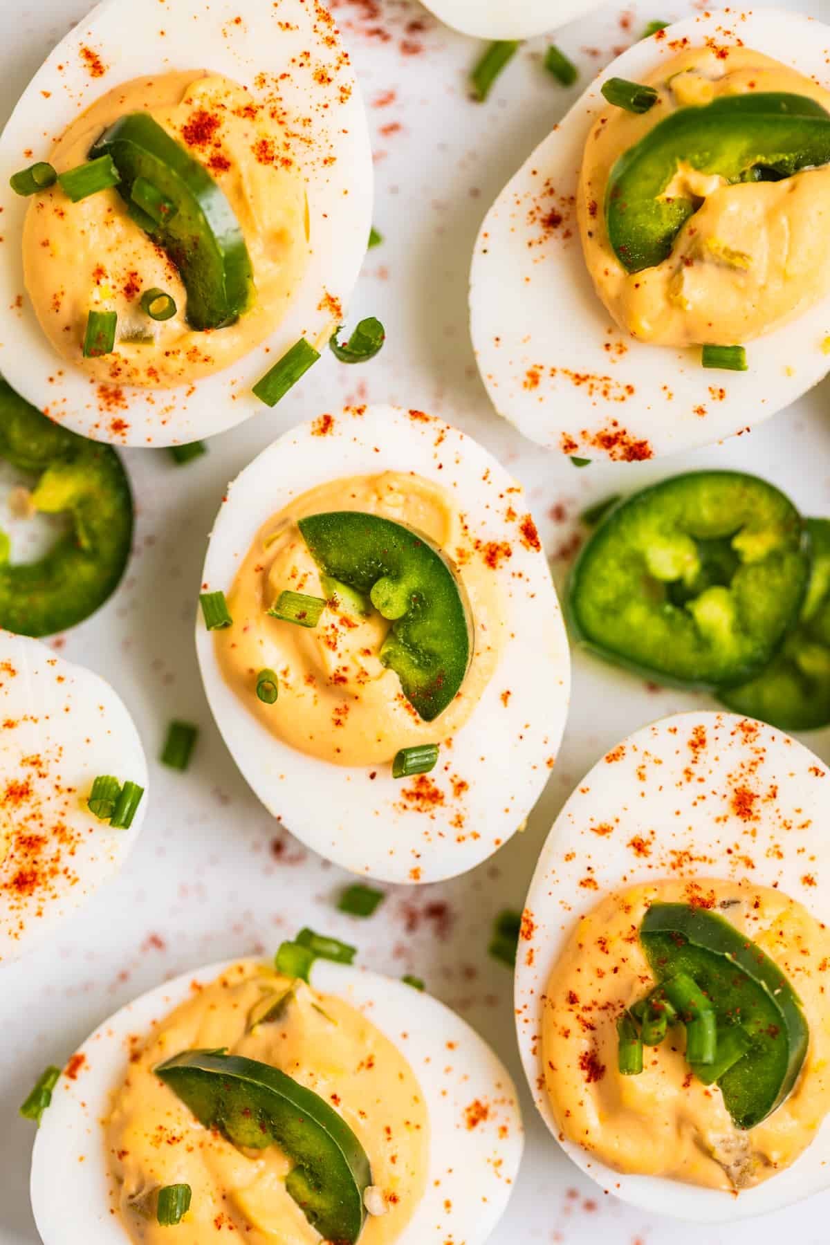 Close-up shot of spicy sriracha mayo deviled eggs garnished with fresh cilantro