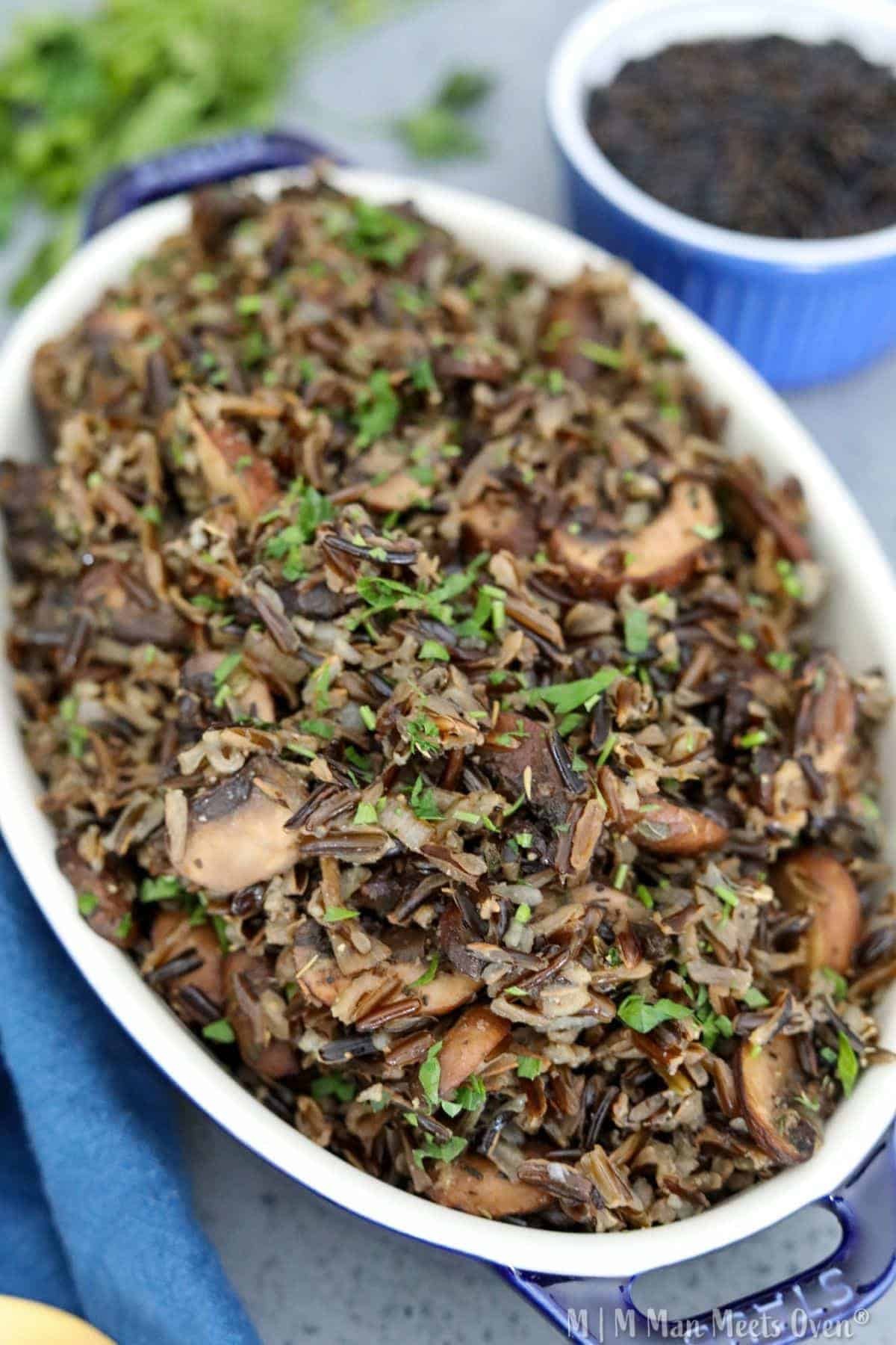 Wild mushroom medley rice dish served in a rustic bowl