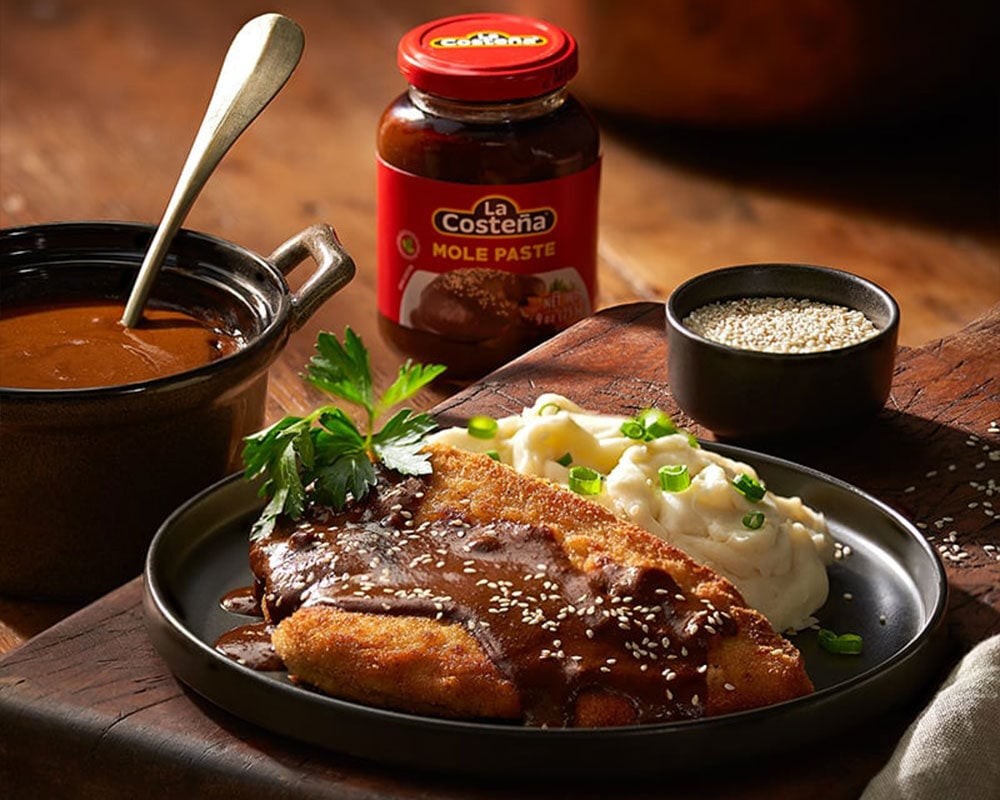 fried chicken covered in mole poblano sauce