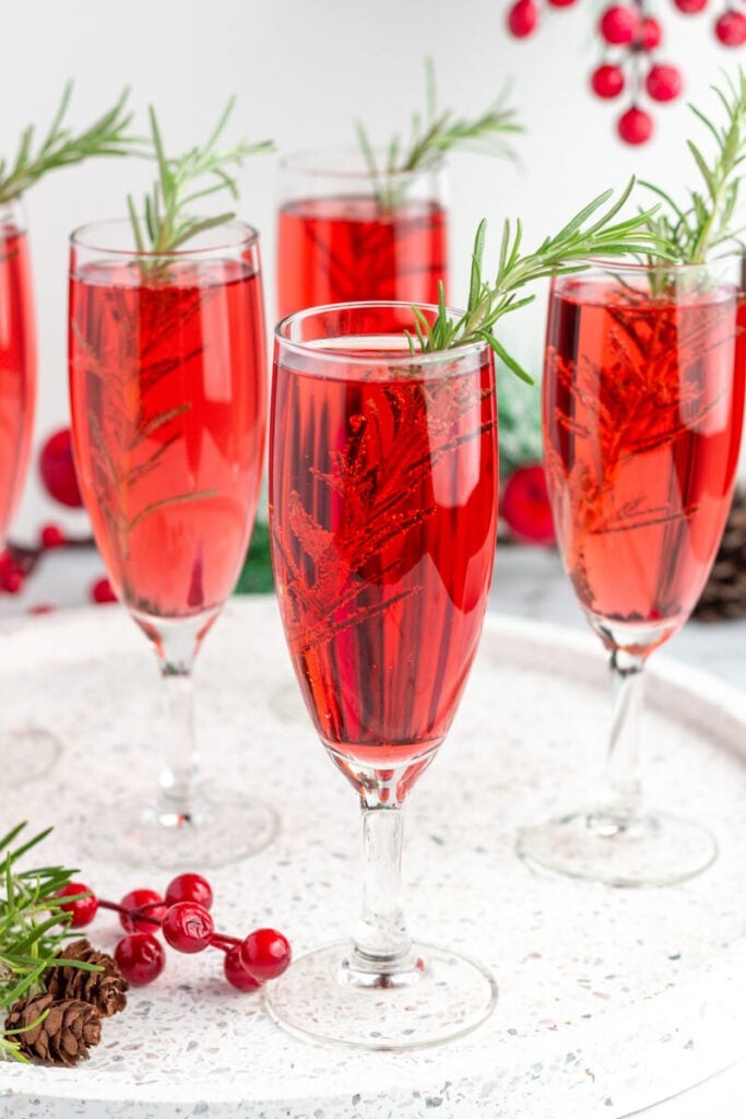 elegant non-alcoholic holiday mocktail in a champagne flute, festive setting