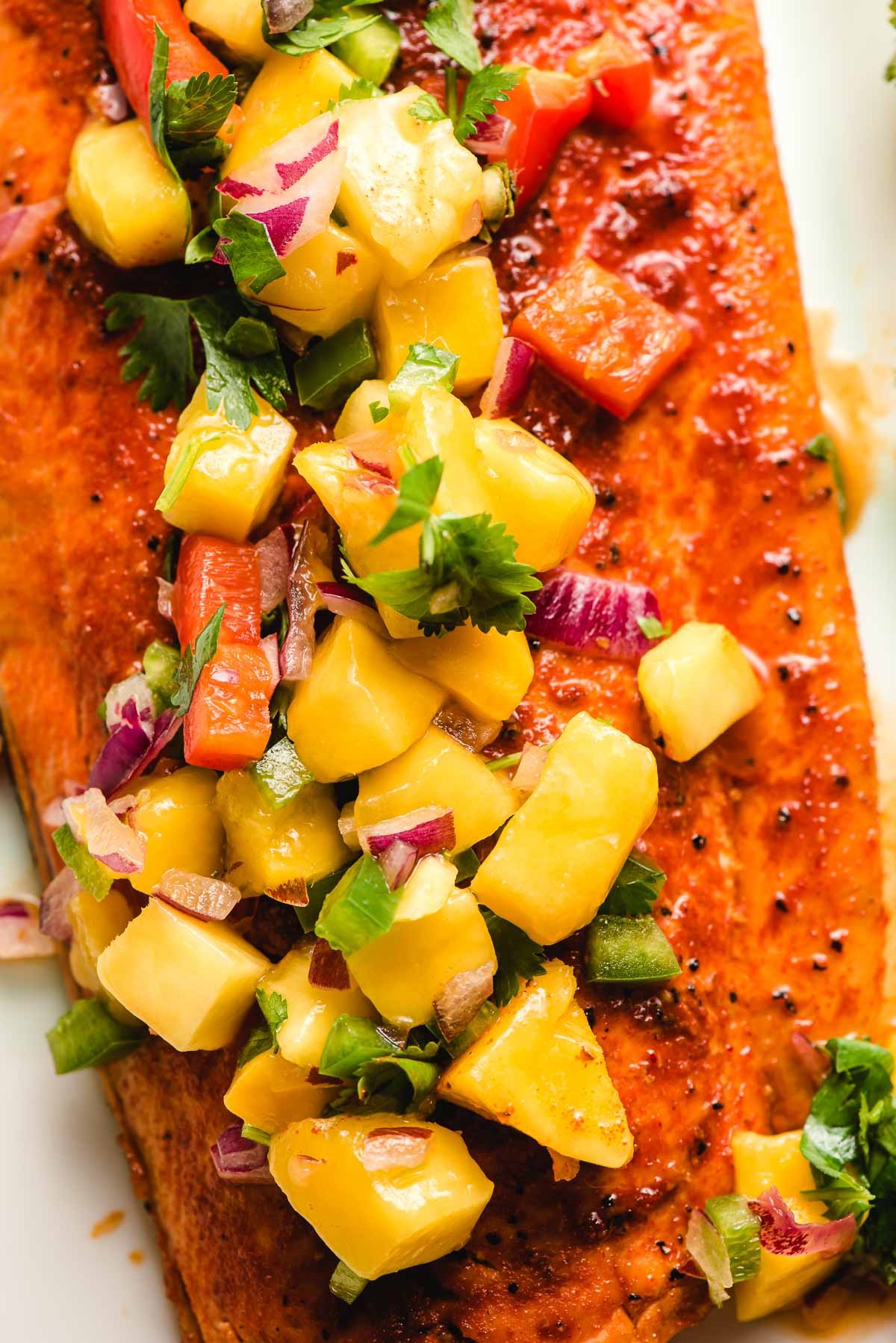 grilled paprika rubbed salmon topped with fresh mango salsa