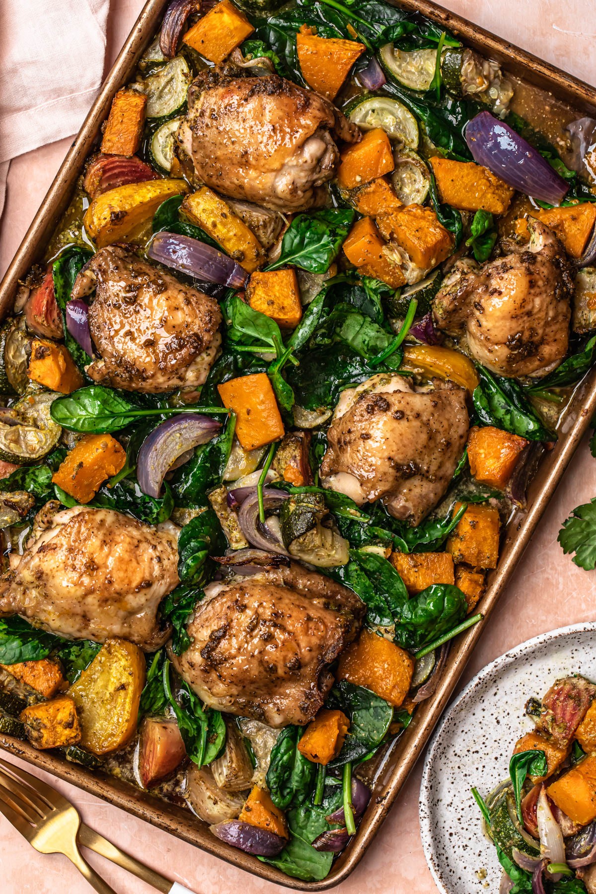 Sheet pan of pesto chicken and roasted vegetables