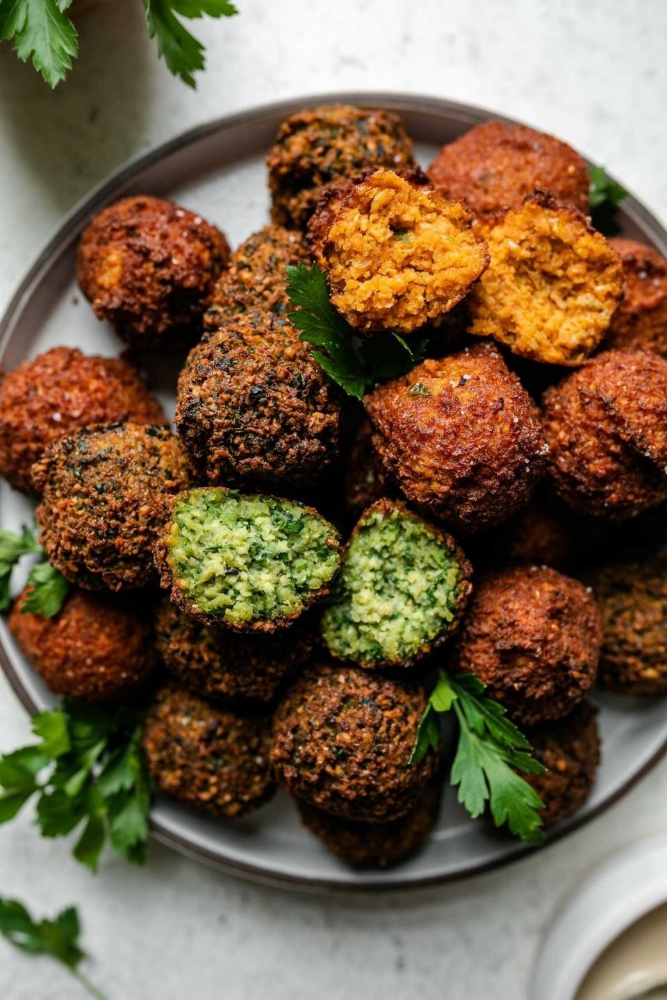 Close-up shot of crispy falafel with fresh parsley garnish