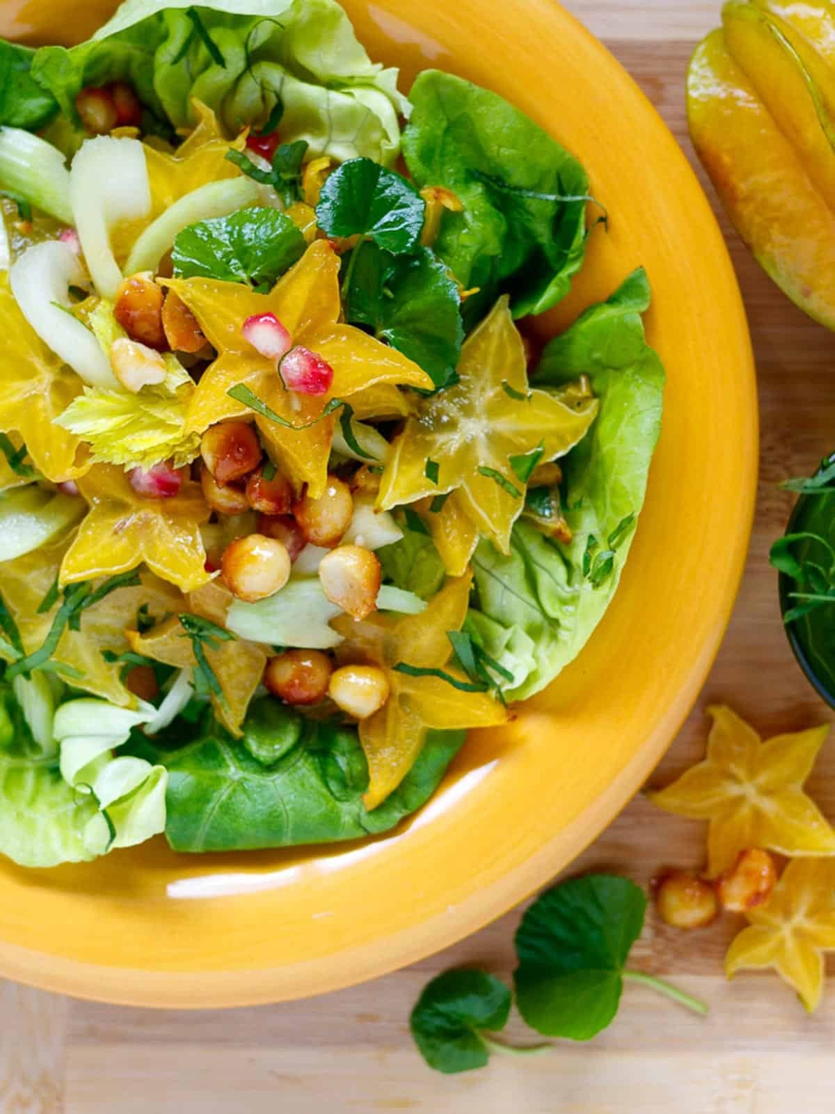 vibrant starfruit ginger kale salad in a bowl