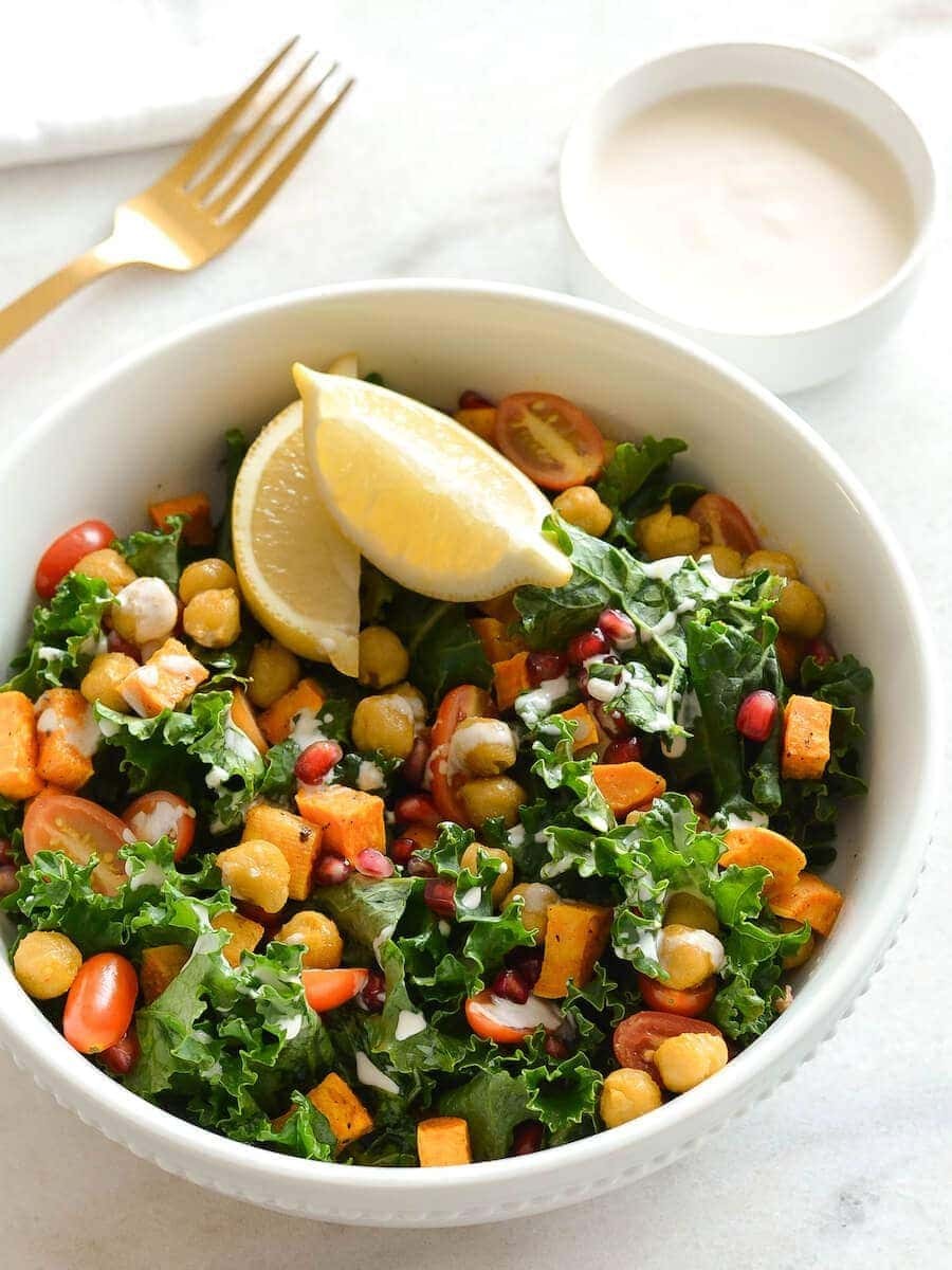 Sweet potato and kale injera bowl with vibrant colors and fresh herbs