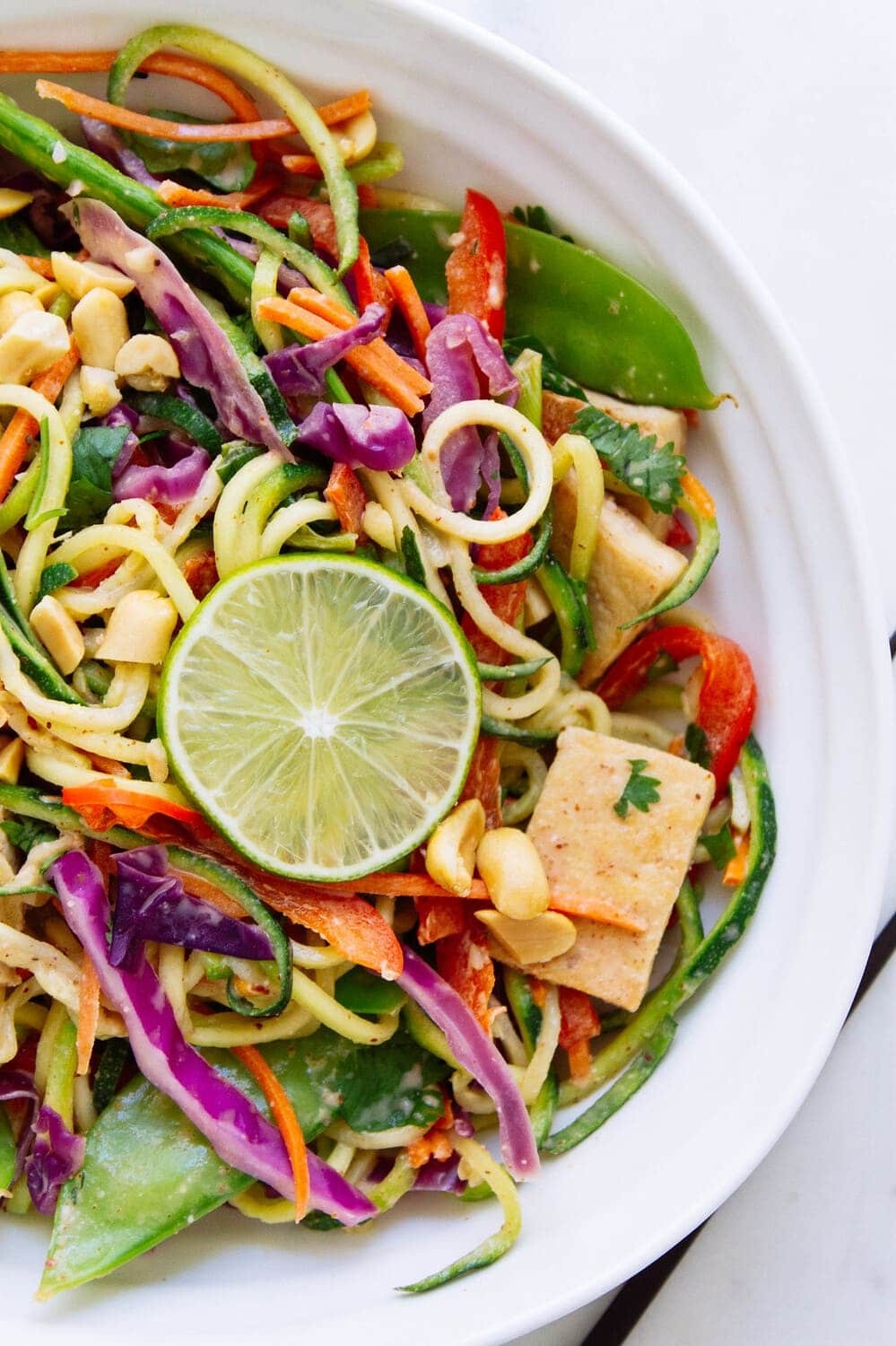 Spicy Peanut Zoodles with Tofu and Veggies in a bowl