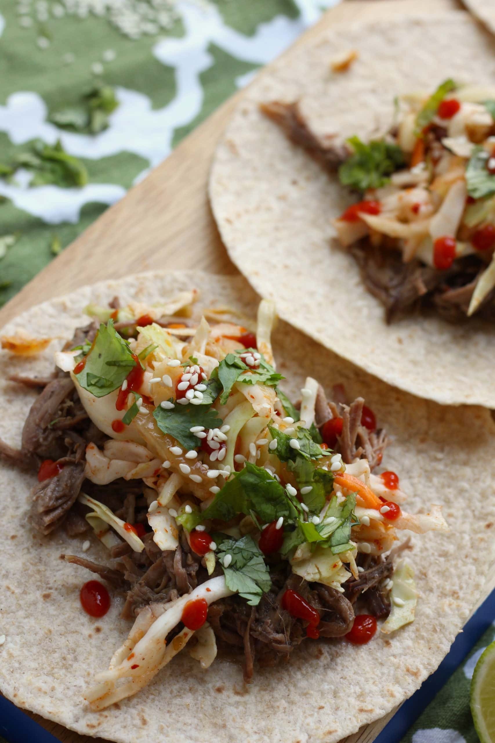 Kimchi and Ginger Soy Glazed Tacos served with a vibrant slaw