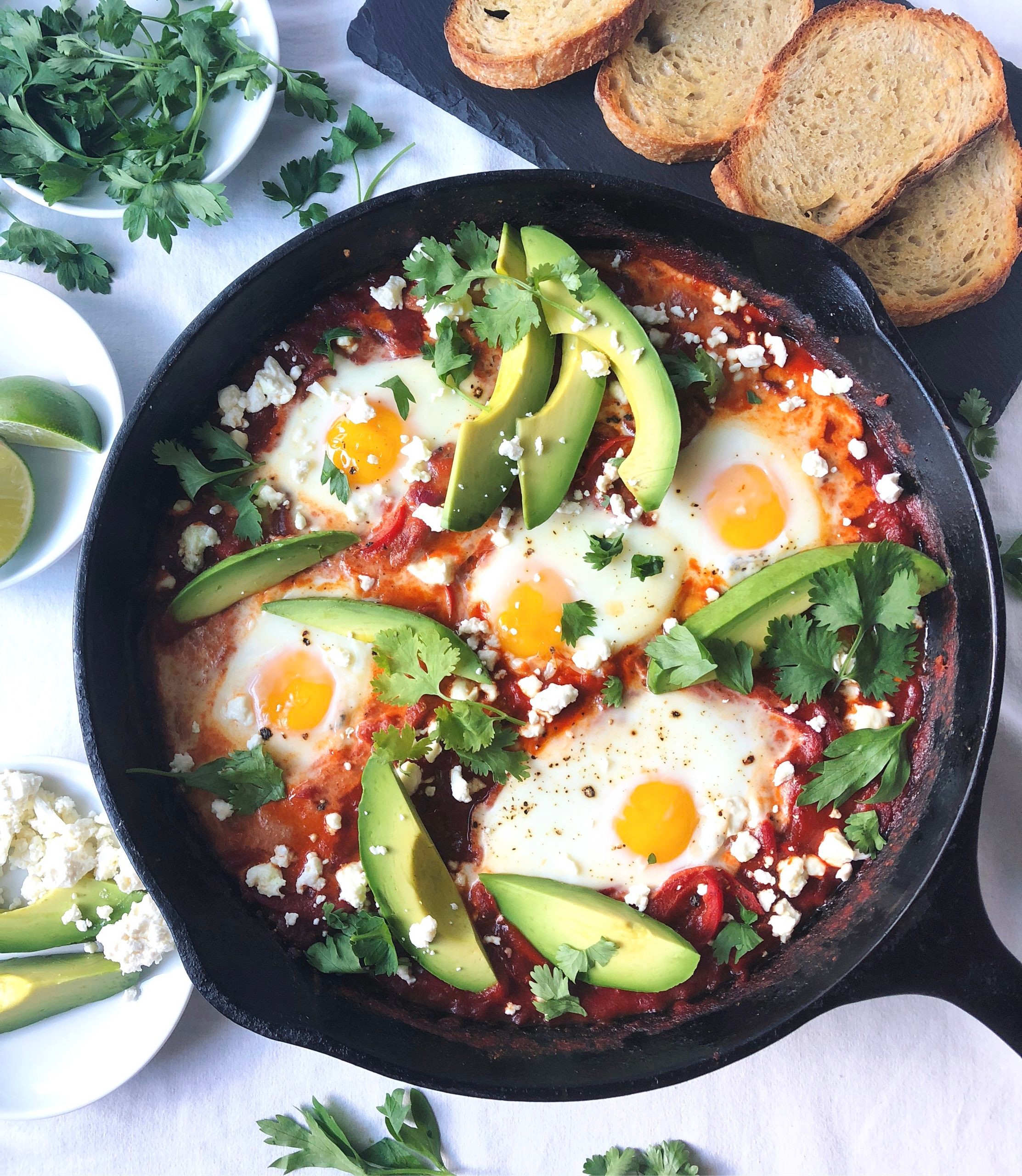 Shakshuka with lobster and truffle oil served in a skillet