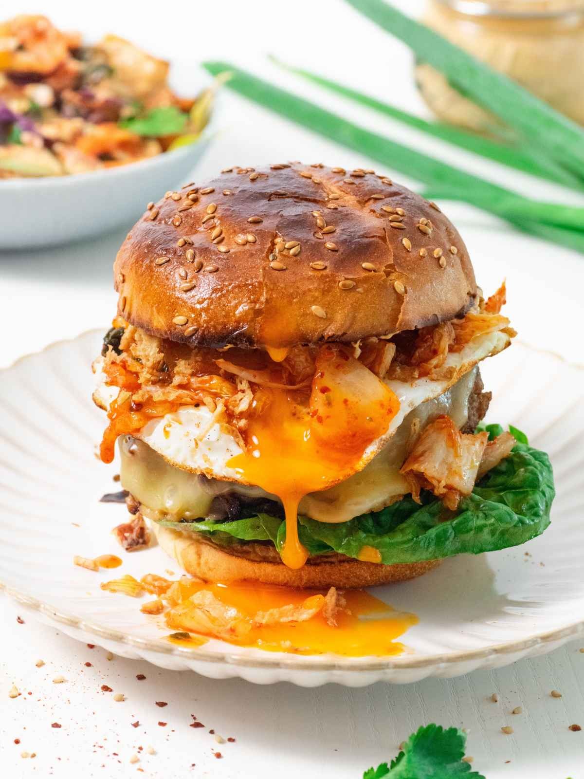 Spicy Kimchi Burger with sesame seeds and melted cheese dripping