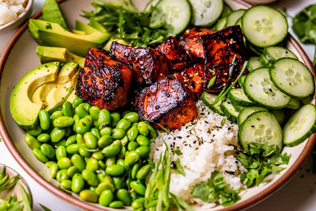 cucumber sriracha salmon poke bowl close up