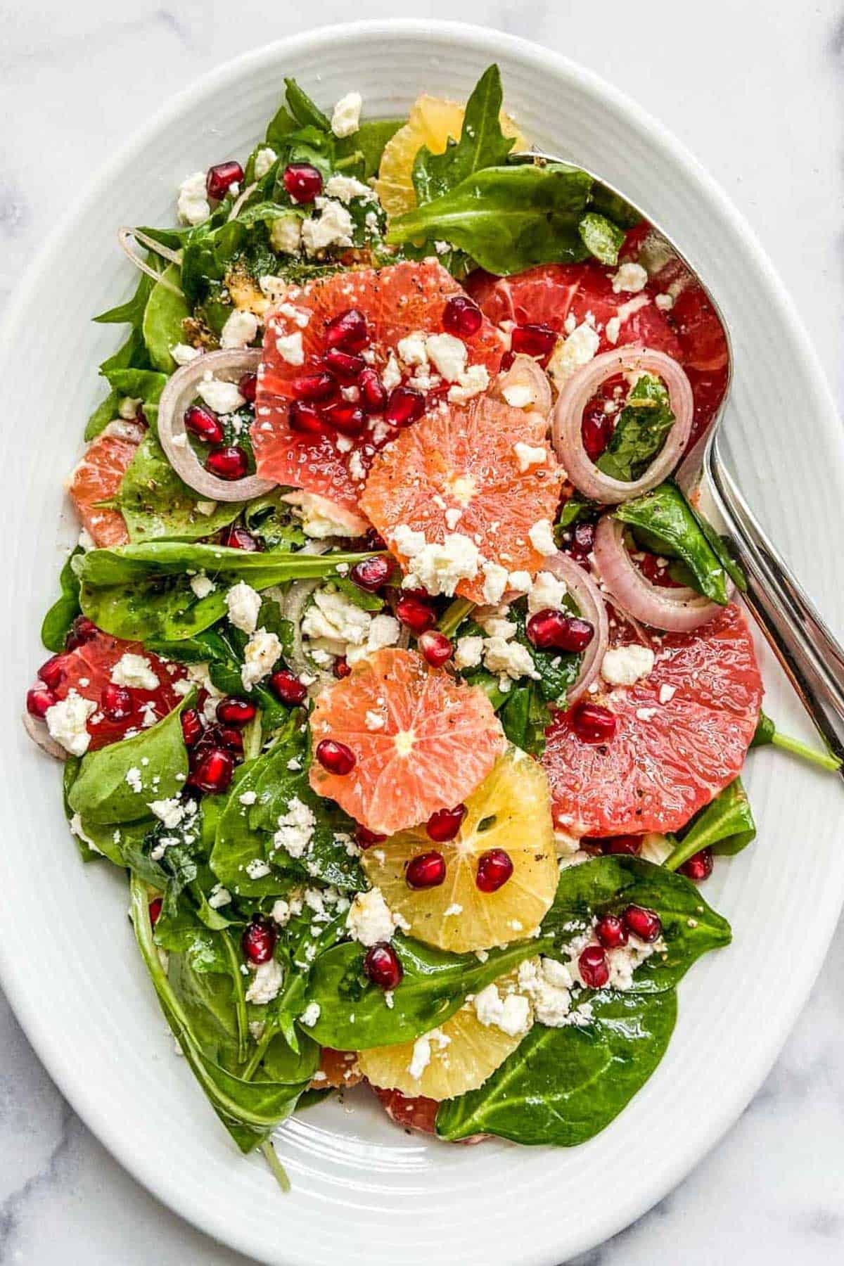 bright and colorful pomelo and pomegranate salad with feta cheese