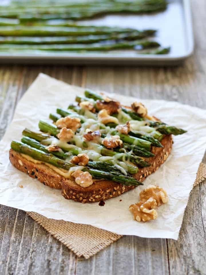 Hummus served with roasted asparagus spears