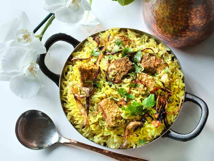 overhead shot of lamb biryani in a pot