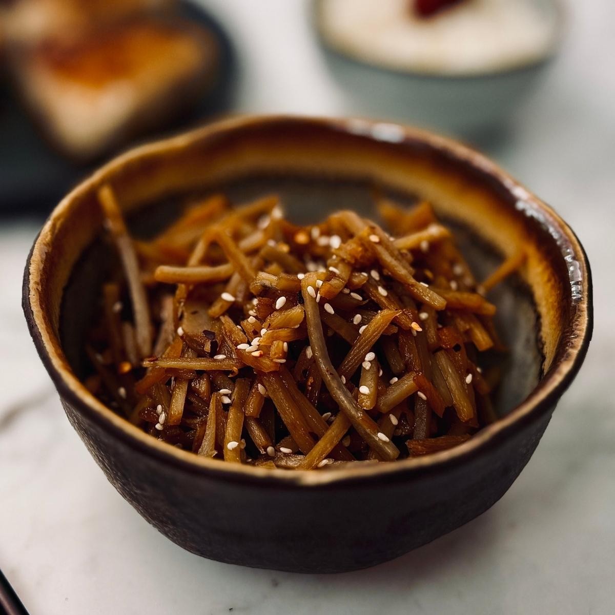 sautéed burdock root with soy sauce and ginger