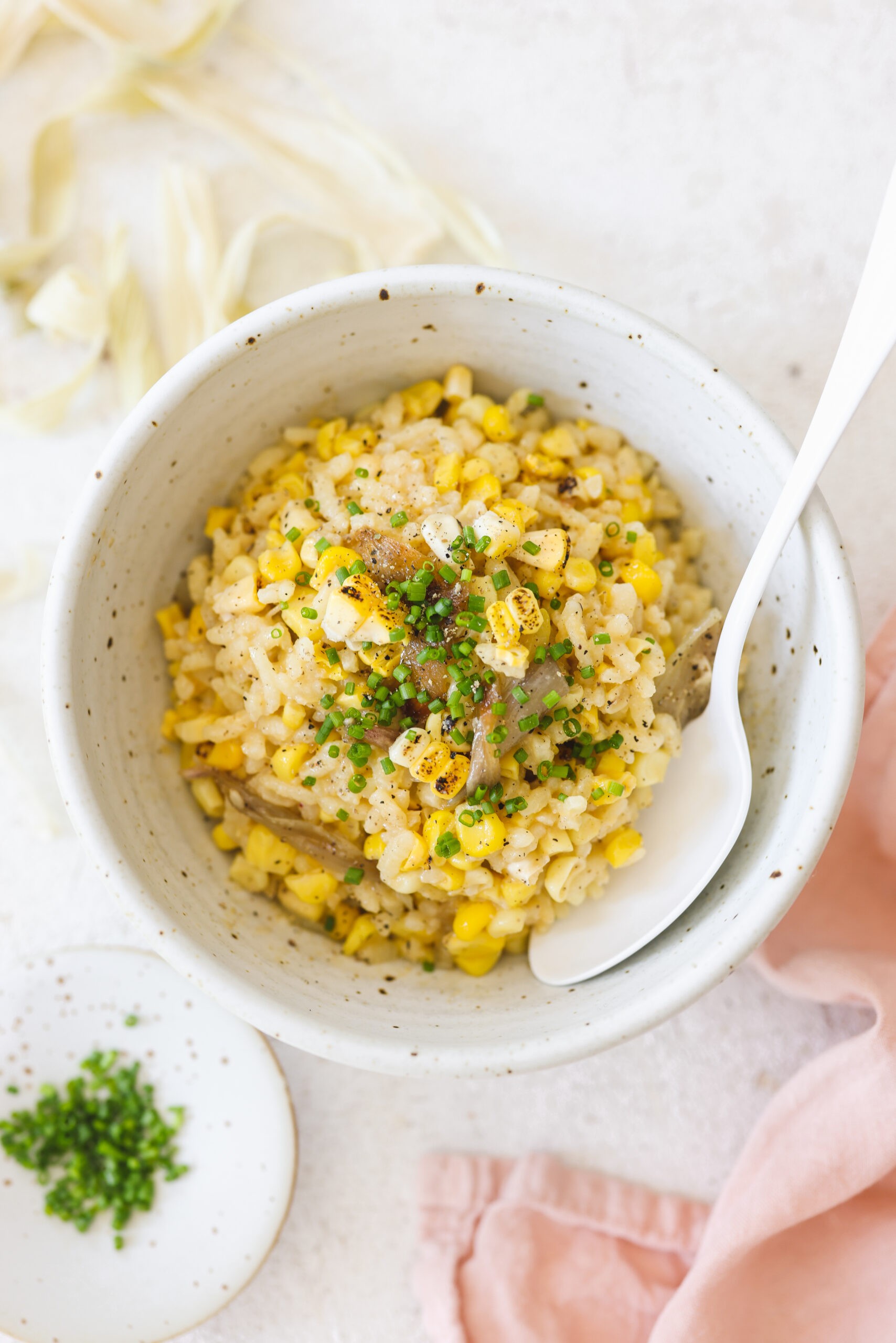 A vibrant, mouthwatering image of Grilled Corn Risotto with Roasted Vegetables. Focus on the creamy texture of the risotto, the charred corn, and the colorful roasted vegetables.