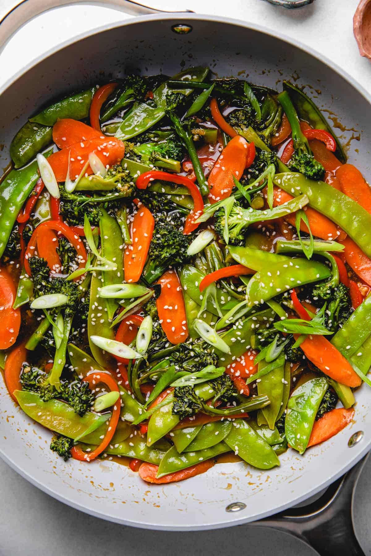 sautéed bell peppers with teriyaki glaze and sesame seeds