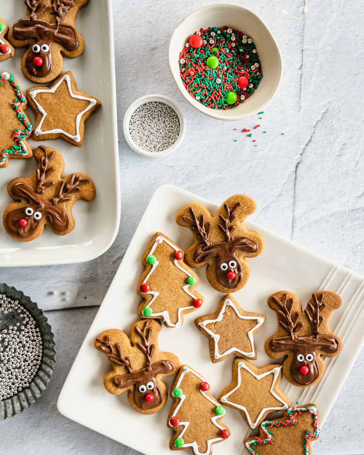 Perfectly decorated gingerbread cookies on a festive tray