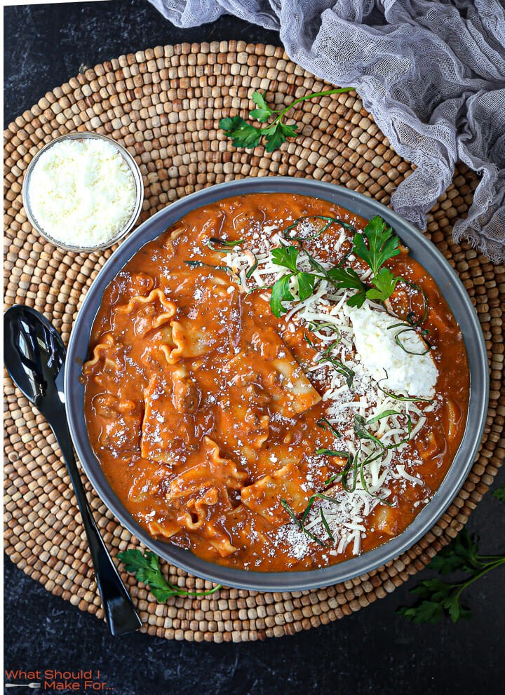 overhead shot of one-pot lasagna soup in a pot with a ladle