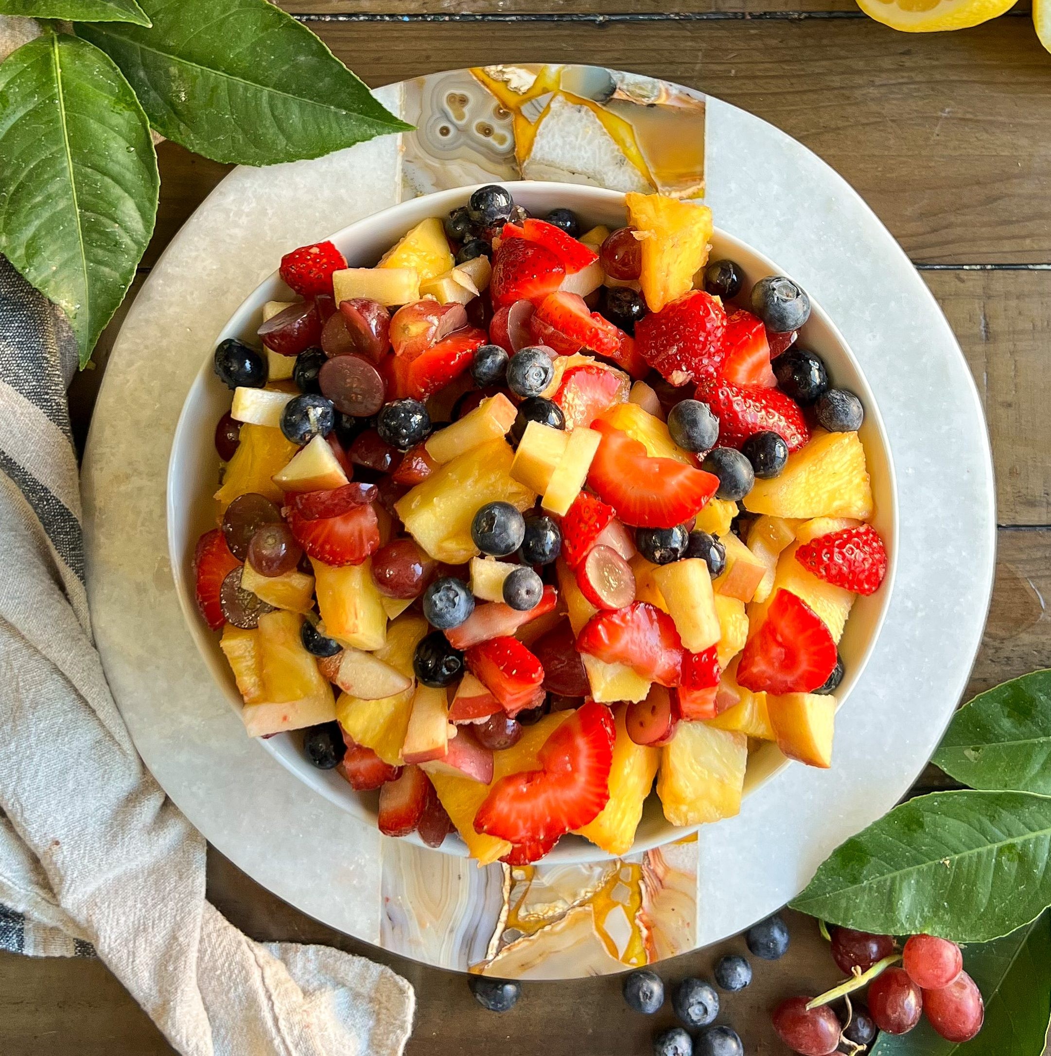 vibrant paleo fruit salad with cardamom-honey dressing