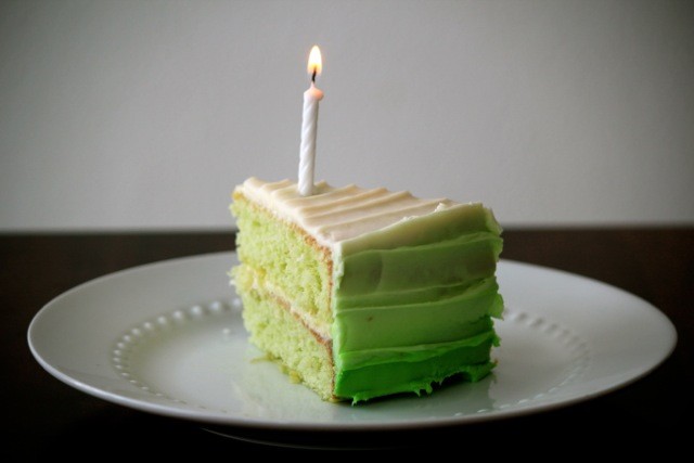 slice of key lime pie cake with birthday candles