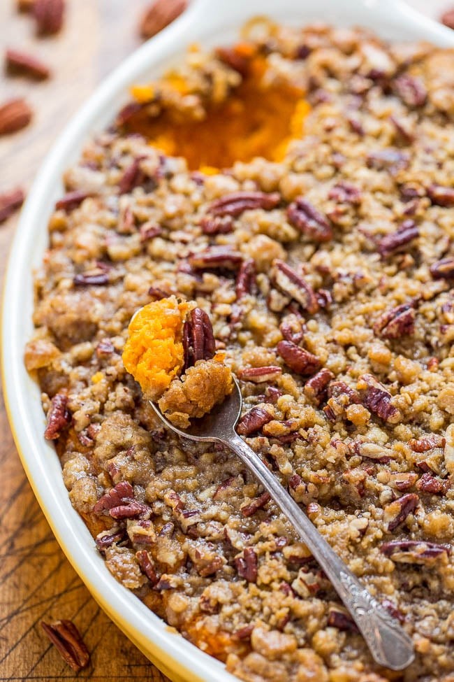 luscious creamy sweet potato casserole with melted butter pecan topping, golden brown