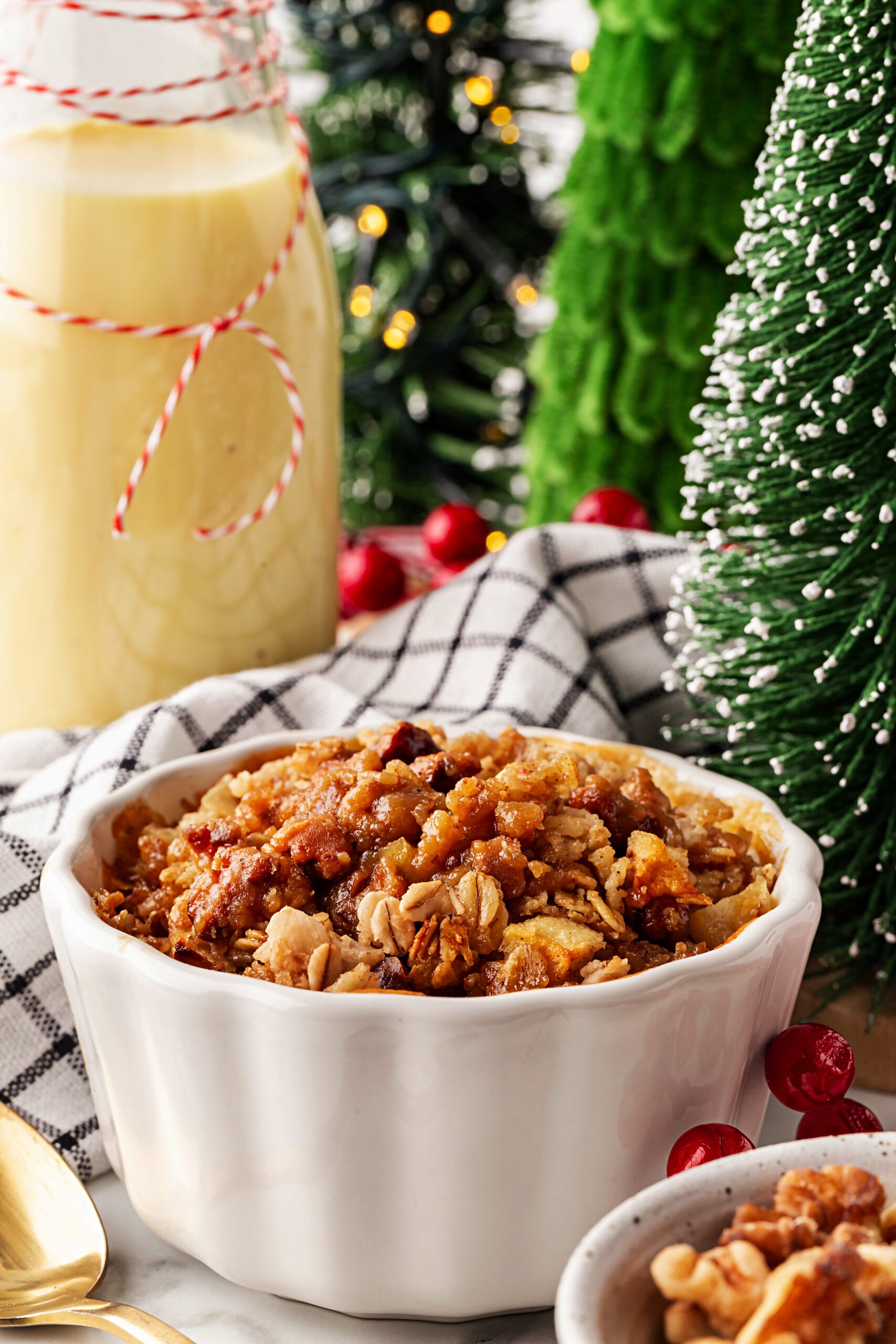 A visually appealing bowl of eggnog oatmeal with holiday-themed toppings