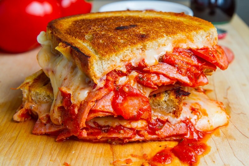 Delicious pizza grilled cheese with melted mozzarella and crispy pepperoni