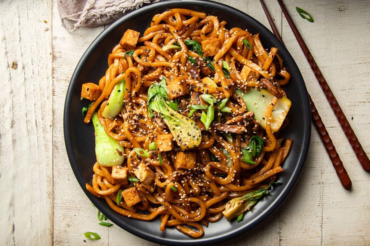 banana udon noodle stir-fry in a wok
