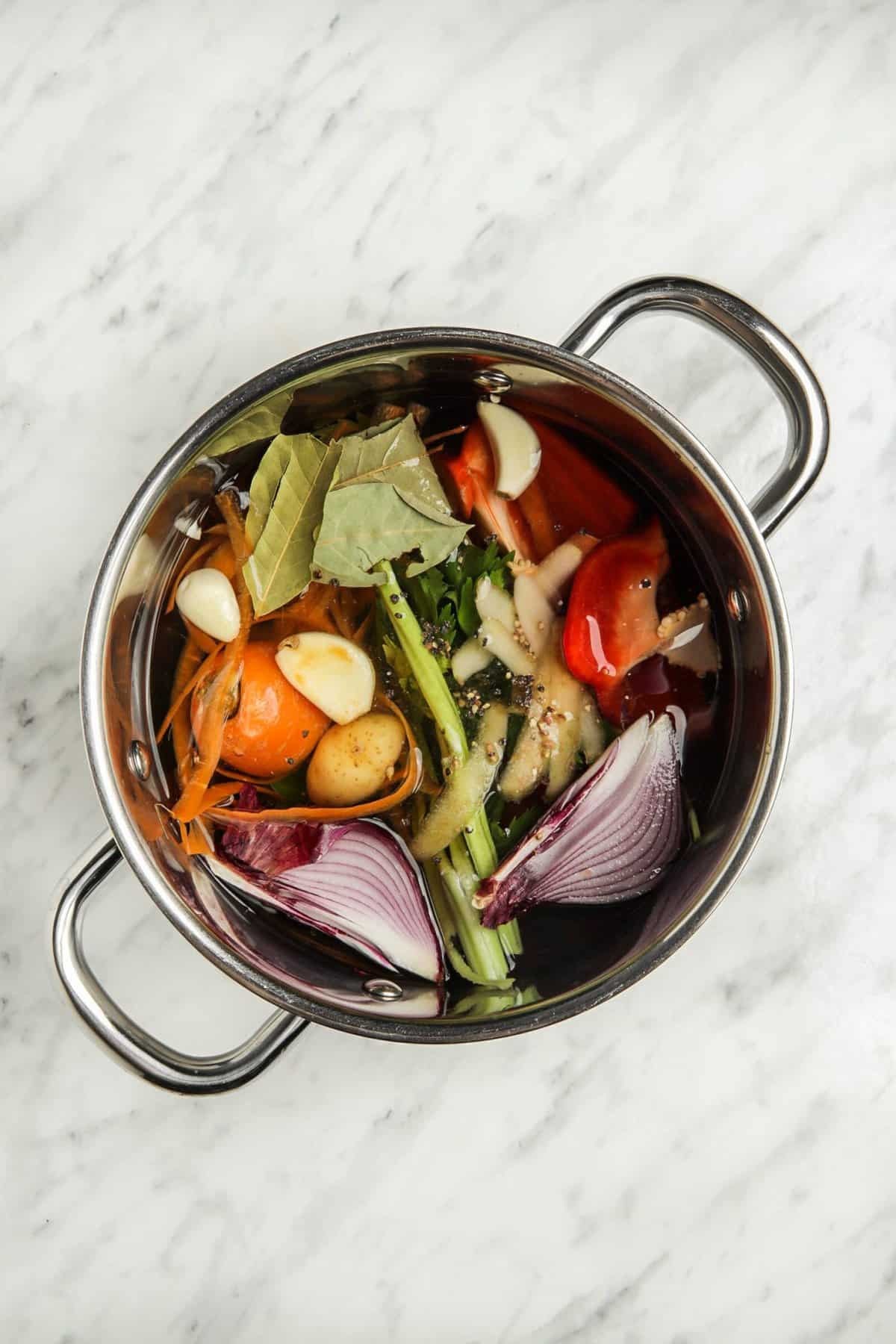 homemade zero waste vegetable broth simmering in pot