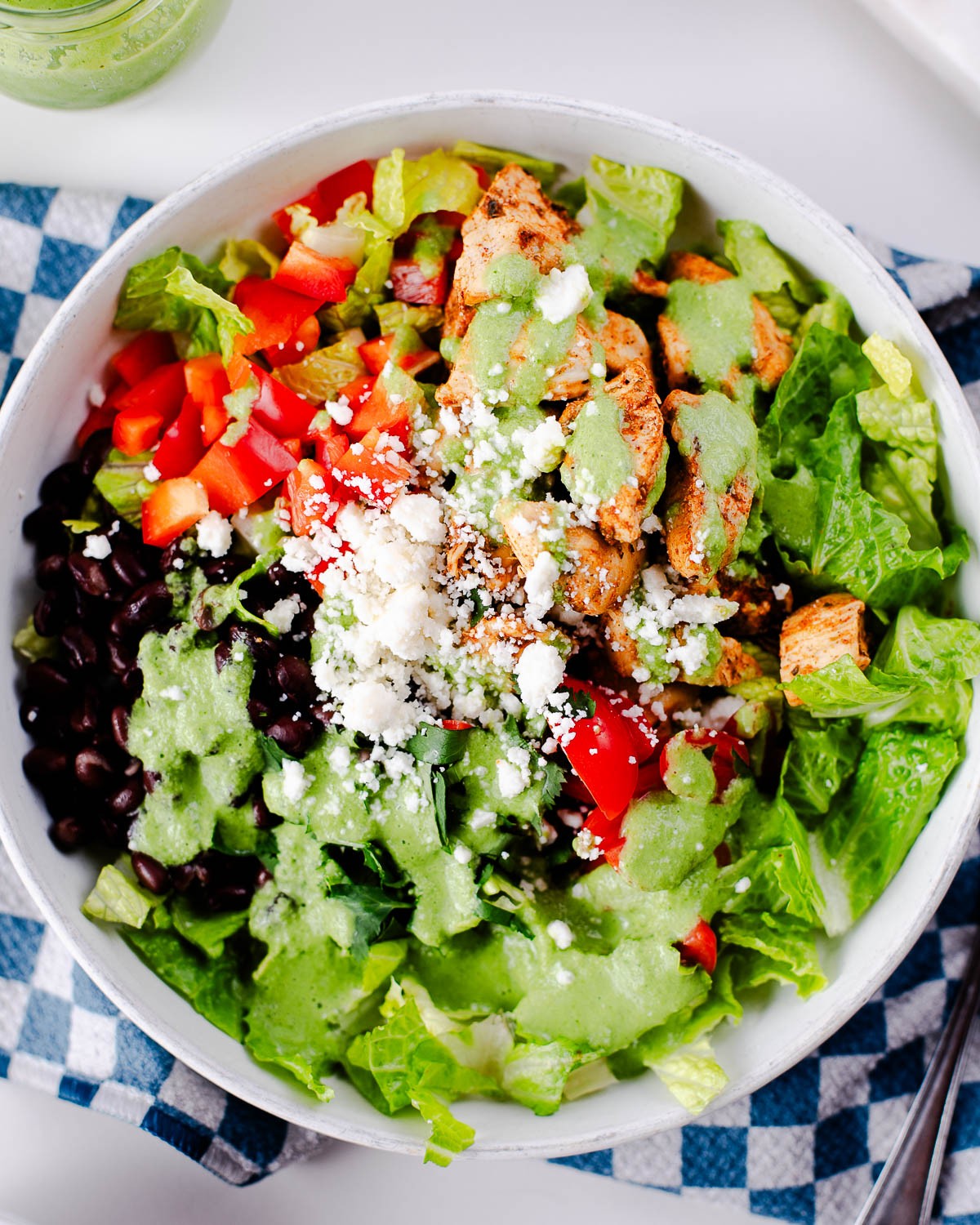 colorful chicken taco bowl with various toppings