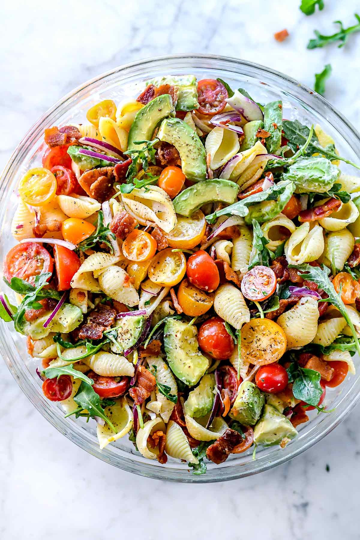 BLT pasta salad with avocado in a serving bowl