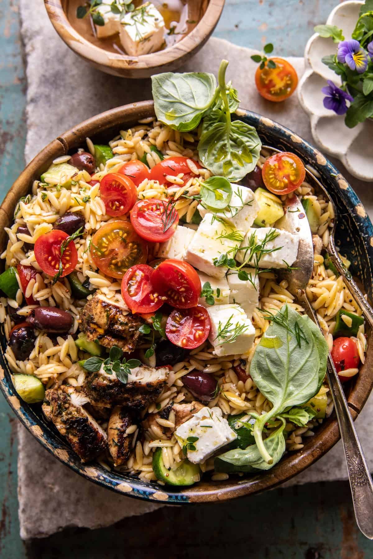 a vibrant bowl of Make-Ahead Greek Orzo Chicken Salad, showcasing the colorful ingredients