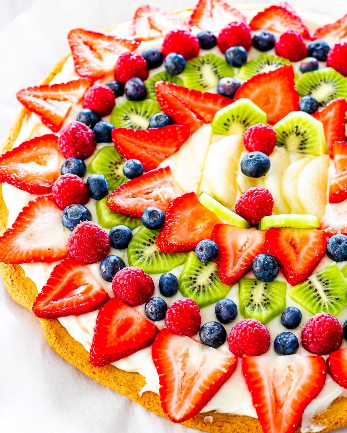 Churro pizza with colorful fresh fruit toppings