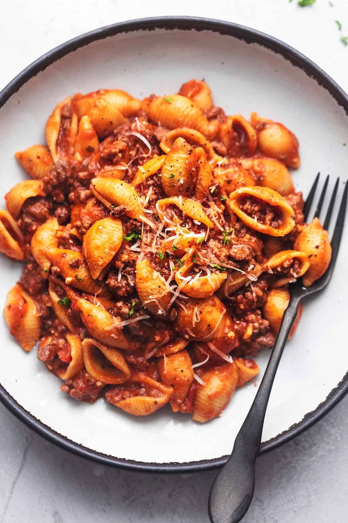 comforting ground beef marinara pasta close-up, cozy dinner setting