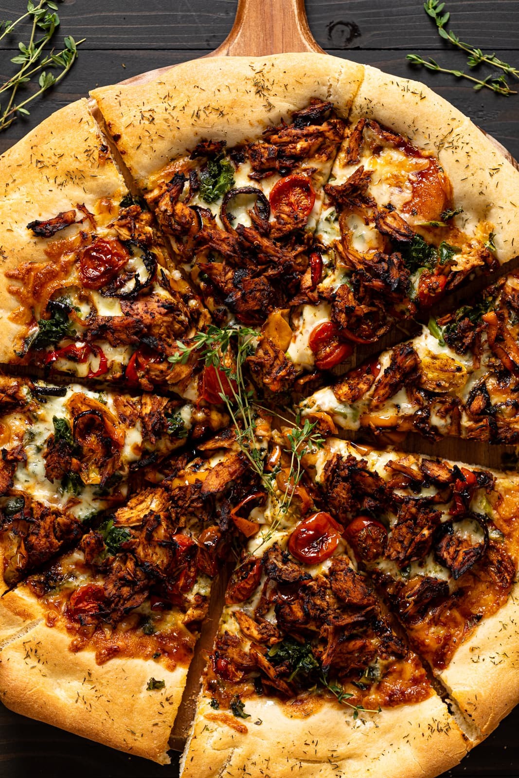 Spicy jerk chicken pizza with colorful toppings