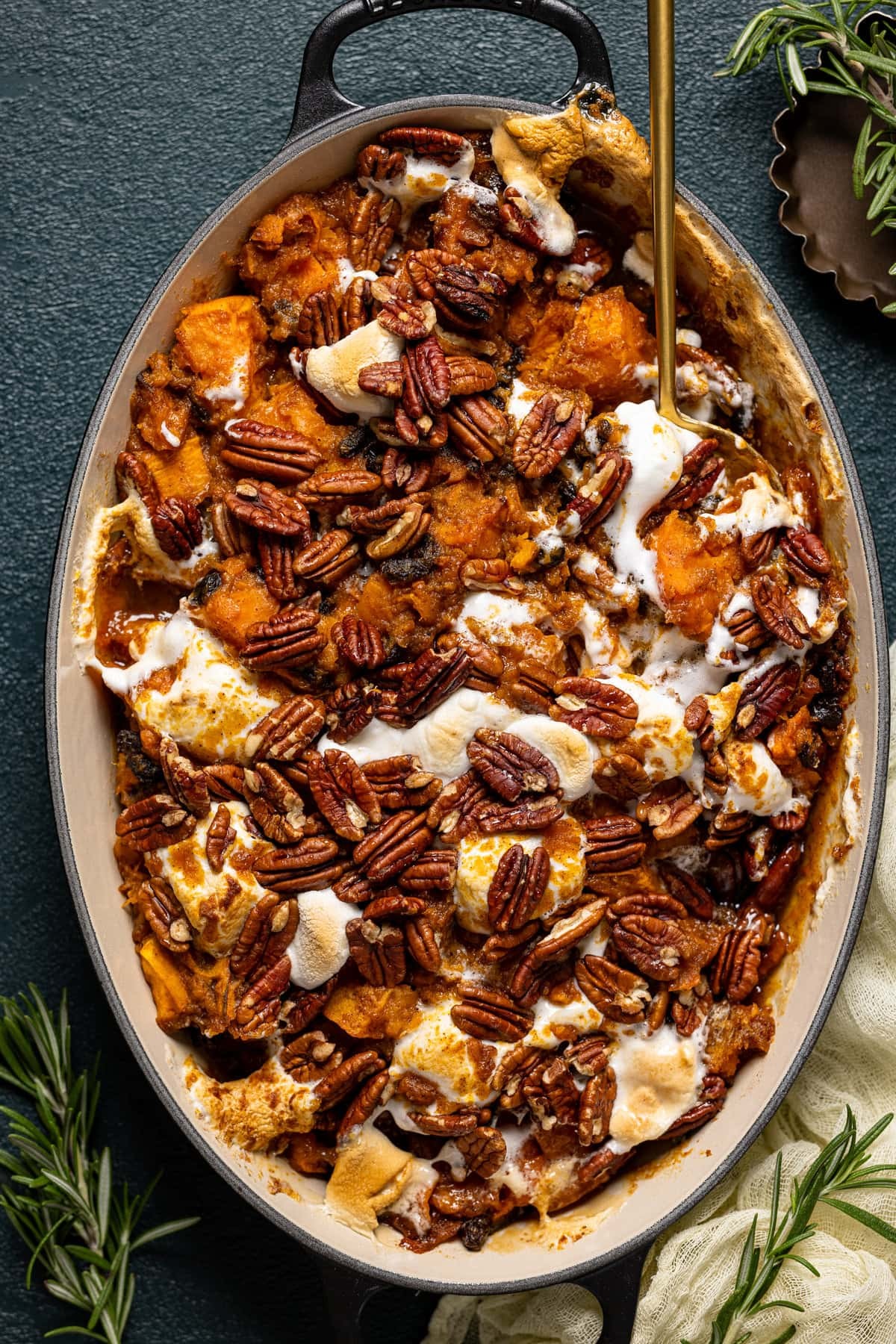 Delicious maple sweet potato casserole with pecan topping, close-up, golden brown, festive setting