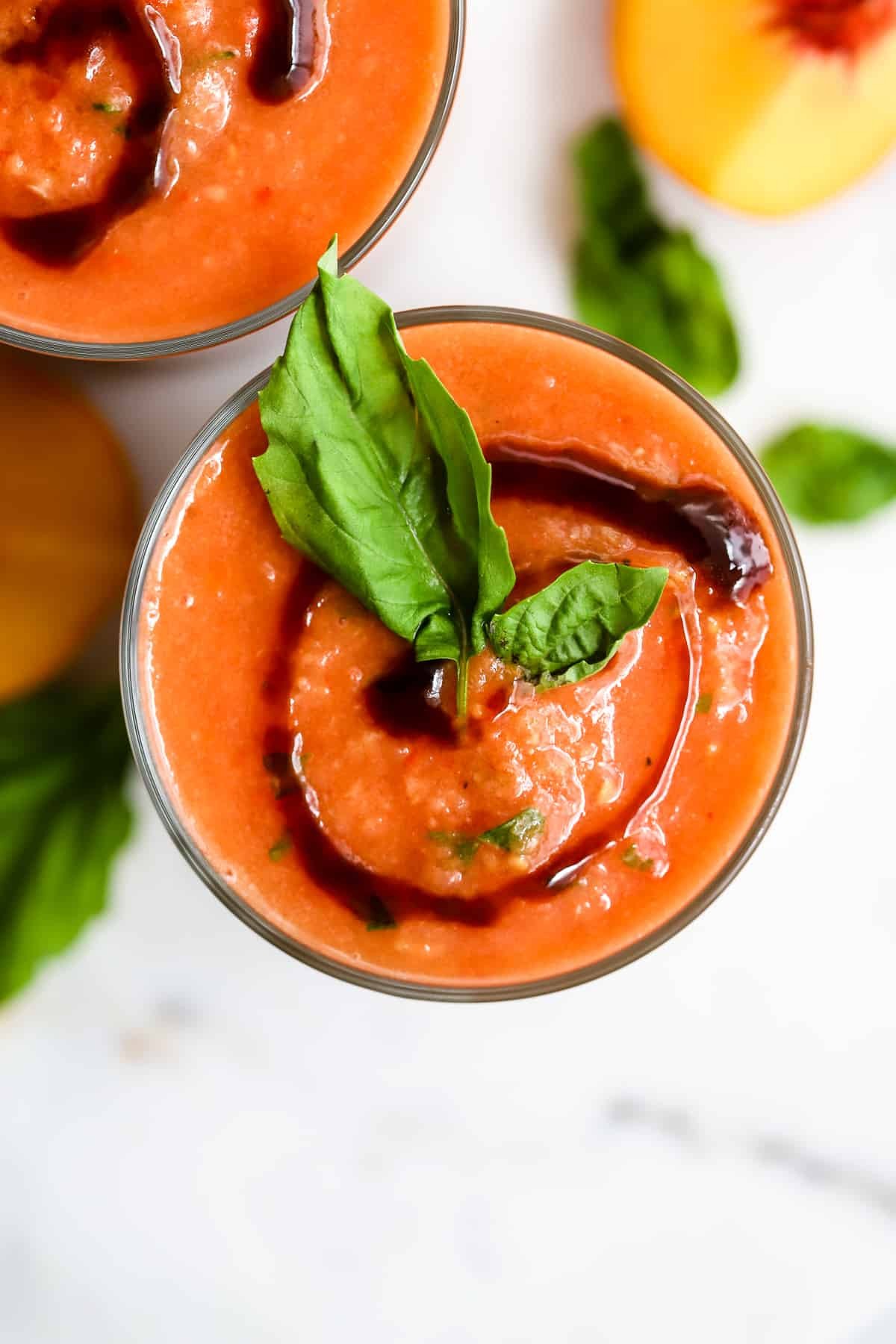 A refreshing bowl of gazpacho with a balsamic glaze drizzle