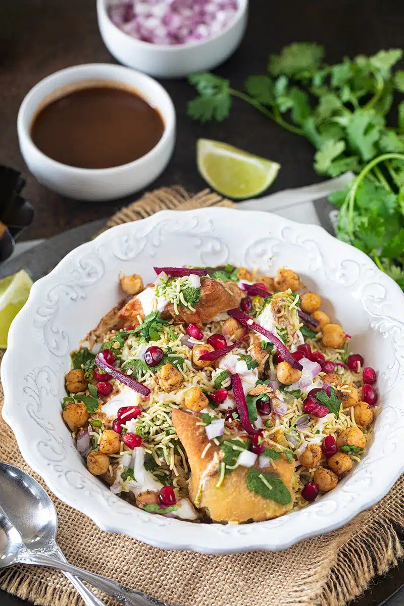 A vibrant and colorful bowl of Paleo Fruit & Chutney, garnished with fresh mint