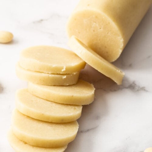 Close-up shot of homemade almond paste, showing its smooth texture and pale color