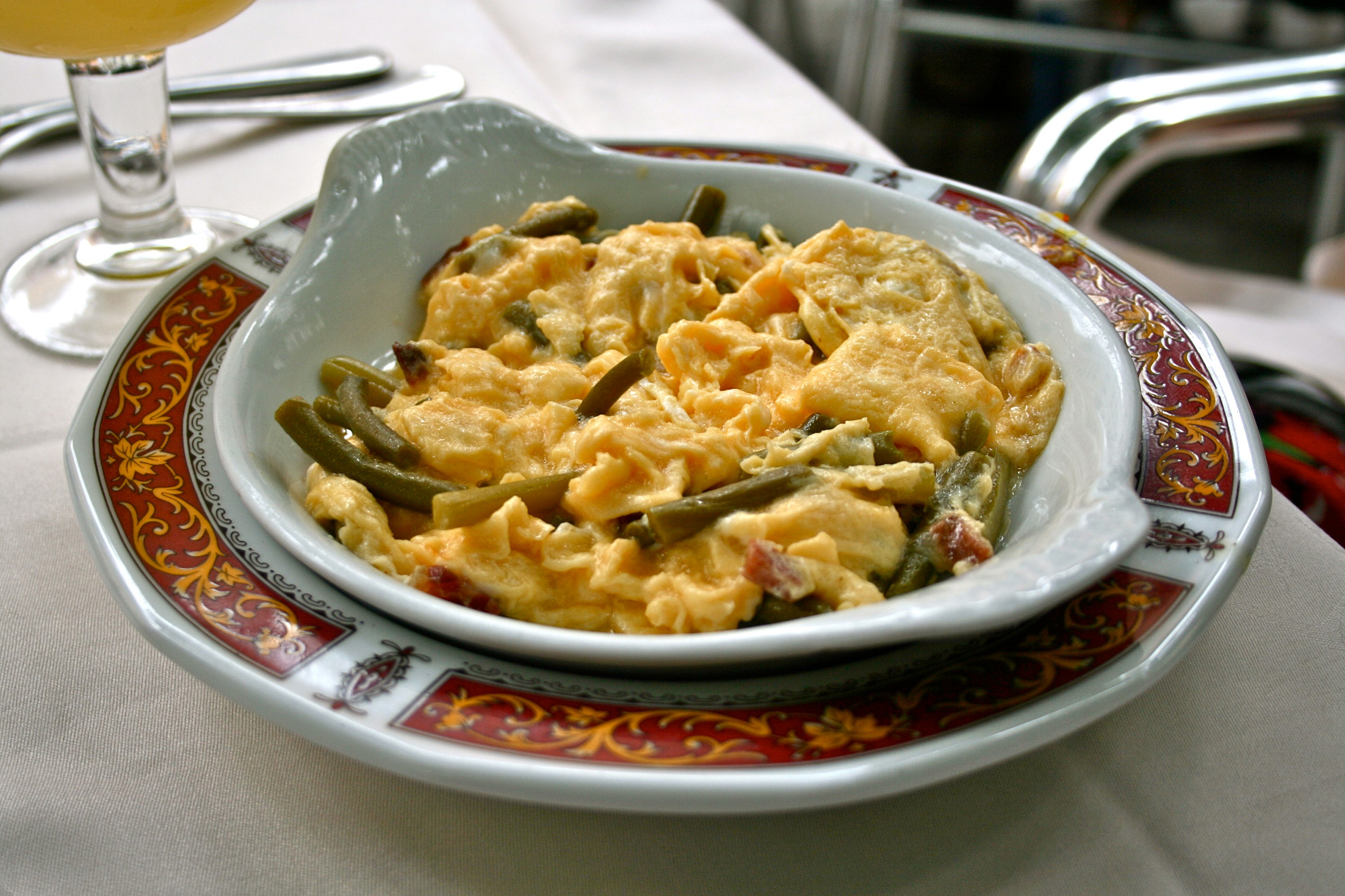 revuelto de ajetes tapas served on a small plate