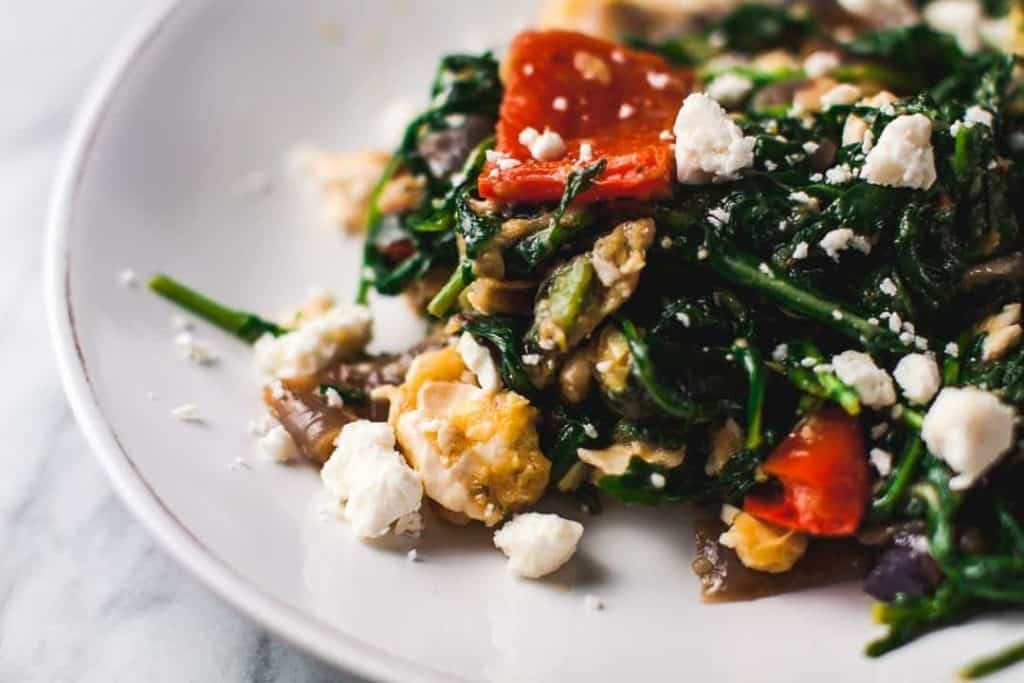 Arugula salad with roasted vegetables, vibrant colors, close-up shot