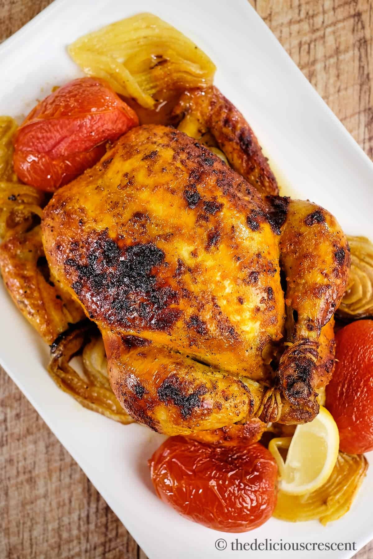 Golden roasted chicken with saffron-infused broth