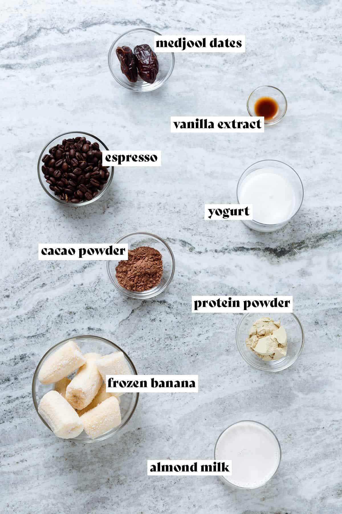 ingredients for coffee almond smoothie laid out on a kitchen counter